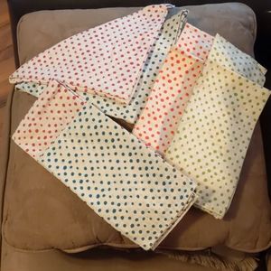 Eight fabric squares.